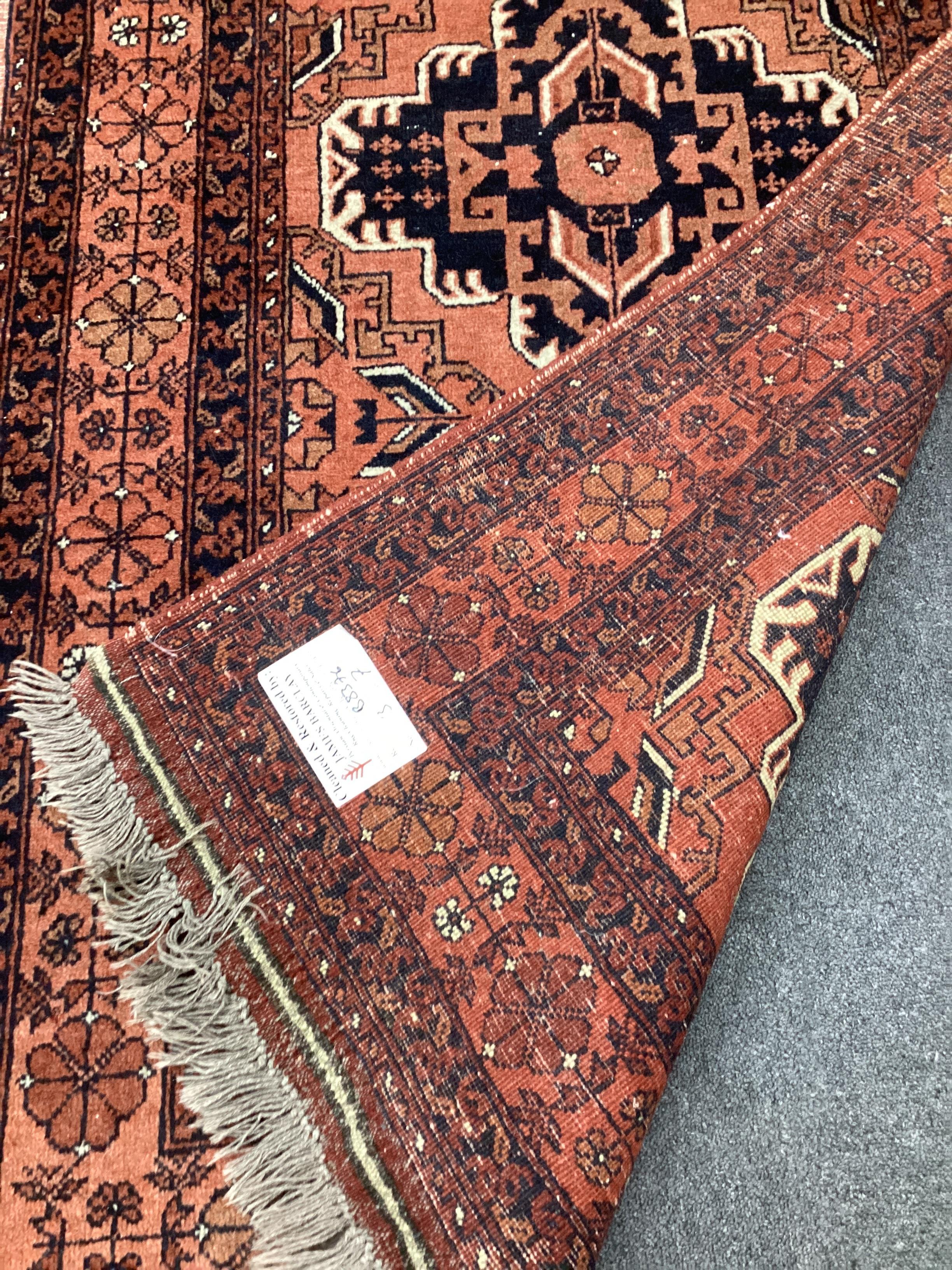 An Afghan red ground rug and a Bokhara gold ground rug, largest 180 x 121cm